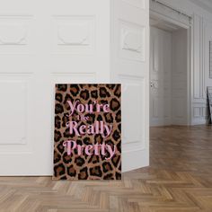 a sign that says you're the really pretty on it in front of a door