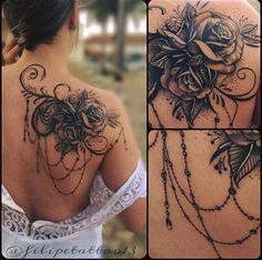 the back of a woman's shoulder with roses and chains on it