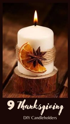 a white candle with an orange slice and star anise sitting on top of it