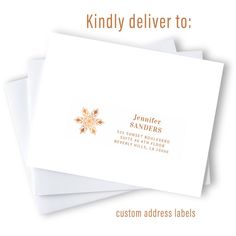 some white envelopes with a gold snowflake on them and the words, kindly deliver to