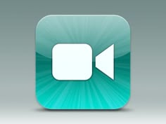 an app icon with the play button highlighted in white on a green background, which appears to be blurry