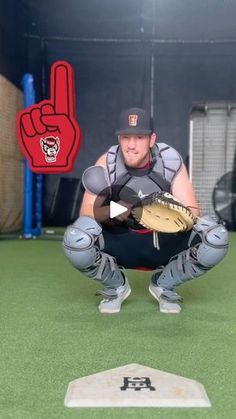 a man kneeling down holding a catchers mitt