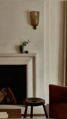 a living room with a fire place and a chair