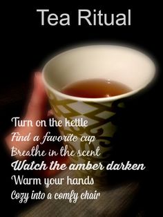 a person holding a cup of tea with the words tea ritual written in front of it