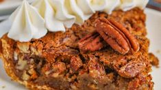 a slice of pecan pie with whipped cream on top