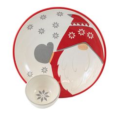 a santa clause plate and bowl set on a white background