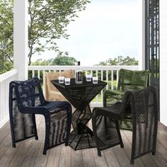 three chairs and a table on a porch