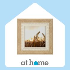 an image of a house with the words at home above it and wheat in front