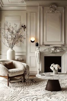 an elegant living room with white furniture and flowers in vases on the fireplace mantel