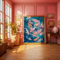 a painting in a room with pink walls and wooden flooring next to potted plants