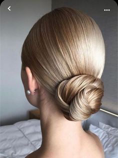 a woman with blonde hair in a bun