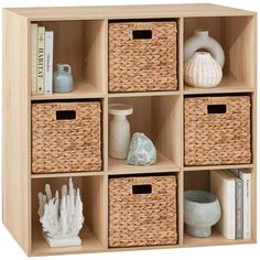 a wooden shelf filled with baskets and books