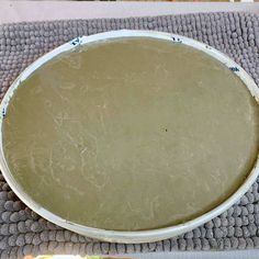 a large white bowl sitting on top of a table