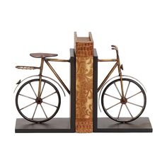 a wooden bicycle is on display in front of a white background