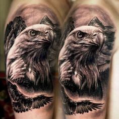 two bald eagle tattoos on both arms and legs, one is black and white with the other