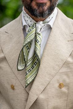 This polka dot pattern with hand-rolled hems will give your casual looks pizzazz. This scarf is a testament to timeless craftsmanship, a blend of care, and passion. The classic neckerchief size: Approx. 27" x 27". It is a comfortably large size that fits most men, unlike smaller bandanas. 100% silk twill: A soft, silky fabric traditionally used for making square scarves because it has a soft drape. Characterized by a diagonal weave which makes it very durable. Hand-rolled hems: For the ultimate Neckerchief Men Fashion Styles, Mens Silk Scarf Outfit, Silk Scarf For Men, Men Silk Scarf Style, Scarf Tied Around Neck Men, Men’s Silk Scarf Fashion, Bandana Styles, Mens Fashion Smart, Hand Roll