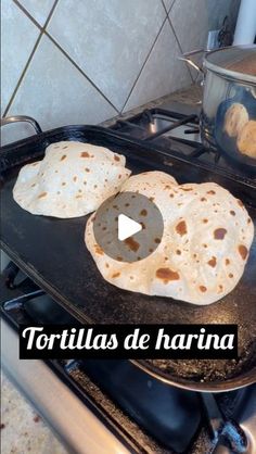 tortillas are being cooked on the stove top