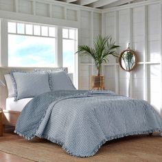 The lifestyle view of the Southern Tide South Shore Blue Quilt by Southern Tide - Blue Coastal Quilts, Coastal Bedding, Blue Quilt, Classic Coastal, Striped Quilt, Southern Tide, Twin Quilt, Blue Quilts, King Quilt