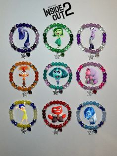 the inside out 2 bracelets are made with beads and charms from disney pixama