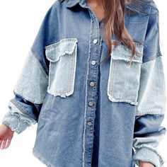 a woman wearing a denim shirt with ripped sleeves