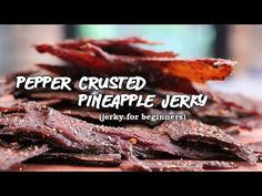 the words pepper crusted pineapple jerry are in front of an image of dried fruit