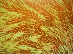 an orange and yellow background with leaves