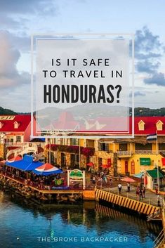 a harbor with boats and buildings in the background that says is it safe to travel in honduras?