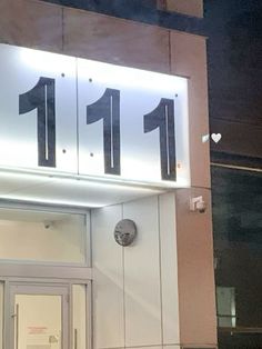 the number 11 is lit up on the building's front door