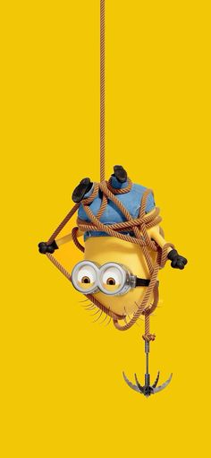 a cartoon character hanging from the side of a rope with an anchor on it's end