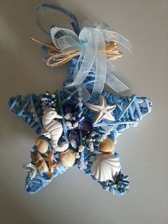 an ornament shaped like a starfish with seashells on it