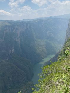 there is a river in the middle of some mountains