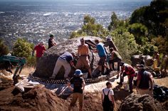 a group of people standing on top of a hill