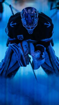 an ice hockey goalie's uniform is reflected in the water