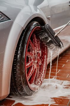 a car washing its wheels with a brush