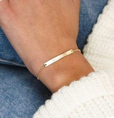 "Our sparkly bar bracelet is a great piece for your everyday look, engrave your favorite word or loved one's name so you could carry it with you at all times ♡ DETAILS * Materials : 14k Gold Filled / Sterling Silver. * Bar size : 35*4mm. * Bracelet chain type : Dainty Rolo. * Bracelet length : 6.25\"+1. 25\" extender = 7.5\" total length. PERSONALIZATION Make your shiny piece extra special by custom engraving!♡ * Engrave letters, initials, numbers and symbols on the bar! * We can engrave up to 1 Dainty Engraved Bracelets For Everyday Wear, Dainty Engraved Bracelets For Everyday, Dainty Engraved Bracelet For Everyday Wear, Dainty Everyday Engraved Bracelets, Minimalist Engraved Bracelets For Friendship, Minimalist Nameplate Bracelet, Minimalist Adjustable Bracelet With Engraved Text, Adjustable Name Chain Bracelet In Minimalist Style, Simple Adjustable Engraved Jewelry