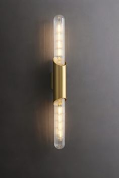 a light that is on the side of a wall with lights attached to it's sides