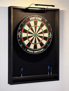 a dart board mounted to the side of a wall