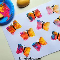 the paper butterflies are painted with acrylic paint