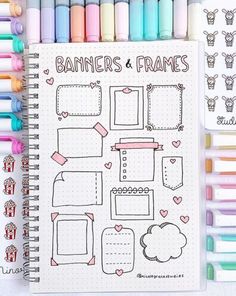 a notebook with markers and frames on it