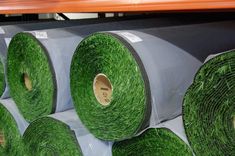 rolls of green grass sitting on top of each other