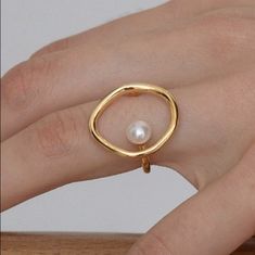 Beautiful unique style gold ring with fresh pearl. Beautiful and feminine.   You will receive the same quality has shown in picture. MEASUREMENTS  - Size adjustable to fit US ring size: US 6, US 7 & US 8 SHIPPING  - Domestic    STANDARD SHIPPING is with USPS first class mail or Parcel Select with delivery confirmation. Priority Mail upgrade is available by selecting option in your cart before checkout.  - International    Shipping outside the USA is by First Class International. Tracking is not available for all international packages from the USA and shipping can take weeks. BASIC JEWELRY CARE  - Remove all jewelry before showering or cleaning.  - Put jewelry on after applying makeup and fragrance    - Don't wear jewelry in swimming pools and spas Thanks for supporting handmade items! Basic Jewelry, Etsy Gold Ring, Support Handmade, How To Apply Makeup, Pearl Ring, Cute Jewelry, Rings Statement, Jewelry Care, Priority Mail