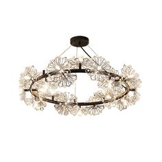 a circular chandelier with glass flowers hanging from the ceiling, on an isolated white background