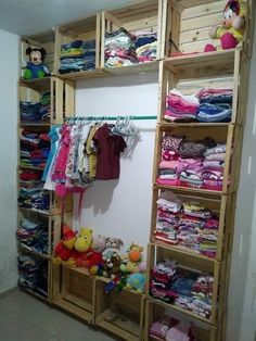 the closet is full of children's clothing and toys