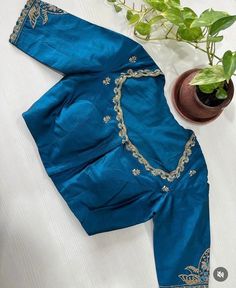 Hand embroidered ready made saree blouse / crop top/stitched saree blouse usa / saree blouse/modern blouse/zardosi blouse/blue saree blouse/ pure silk blouse/ maggam work blouse / white blouse        It is very true that a perfect blouse is the one which makes your saree look stand out !! If you find one of such a style that you have been wanting to have then dont let it go !! we carry such unique trending blouses that instantly add a stylish look to any saree !!     Well..!! we understand that you may not get in your desired size/pattern, here you go with customization according to your size/pattern which we can deliver in 1-2 weeks of time period !!      Here is a beautiful Hand embroidered saree blouse/ crop top  in sea green color that has embossed multi embroidery on sleeves and neck Fitted Silk Saree With Handwork, Fitted Art Silk Blouse With Handwork, Fitted Raw Silk Saree With Handwork, Fitted Art Silk Saree With Handwork, Designer Blue Blouse With Floral Embroidery, Blue Bollywood Blouse With Floral Embroidery, Blue Silk Blouse Piece With Floral Embroidery, Fitted Dola Silk Saree With Handwork, Blue Silk Choli With Floral Embroidery