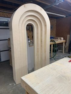 an unfinished arch in the middle of a workbench