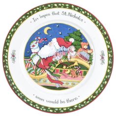 a christmas plate with santa claus on it and other decorations around the rim, which reads i'm hopes that st nicholas soon would be there