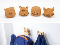 three wooden animals are hanging on the wall