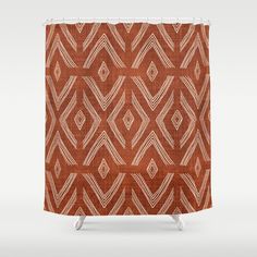 a shower curtain with an orange and white pattern on the front, featuring lines in different directions