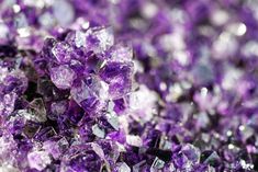 purple crystals are scattered on top of each other