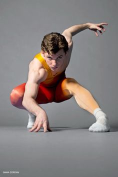 a man is doing a handstand on one leg